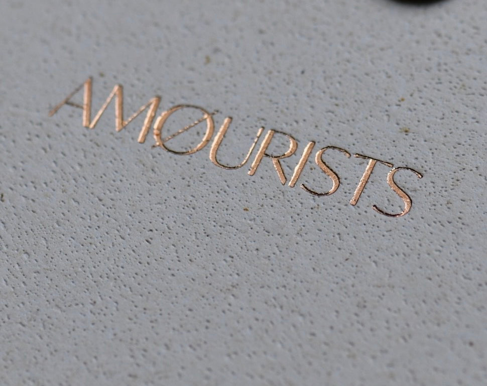 Close-up of Amourists logo on packaging