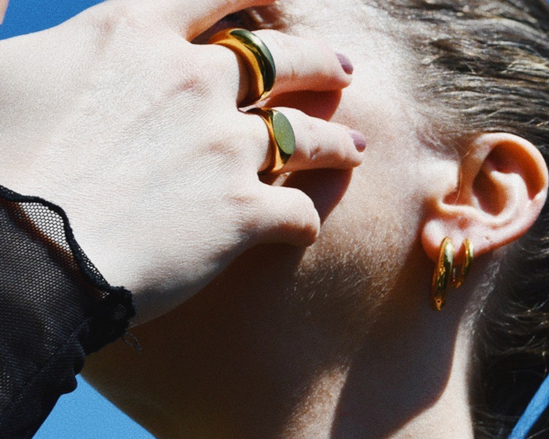 Woman with hands in the face wearing Sonia Ring