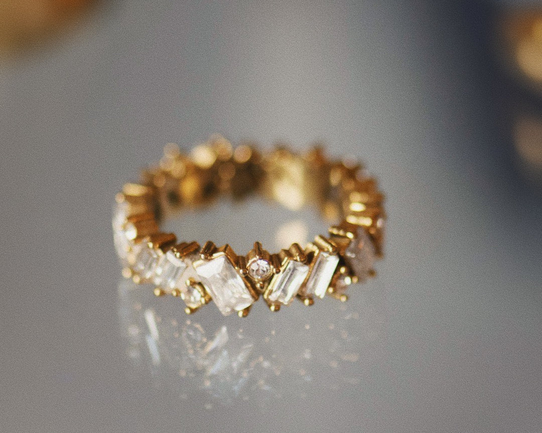Lisa Gold Crystal Ring on mirrored surface