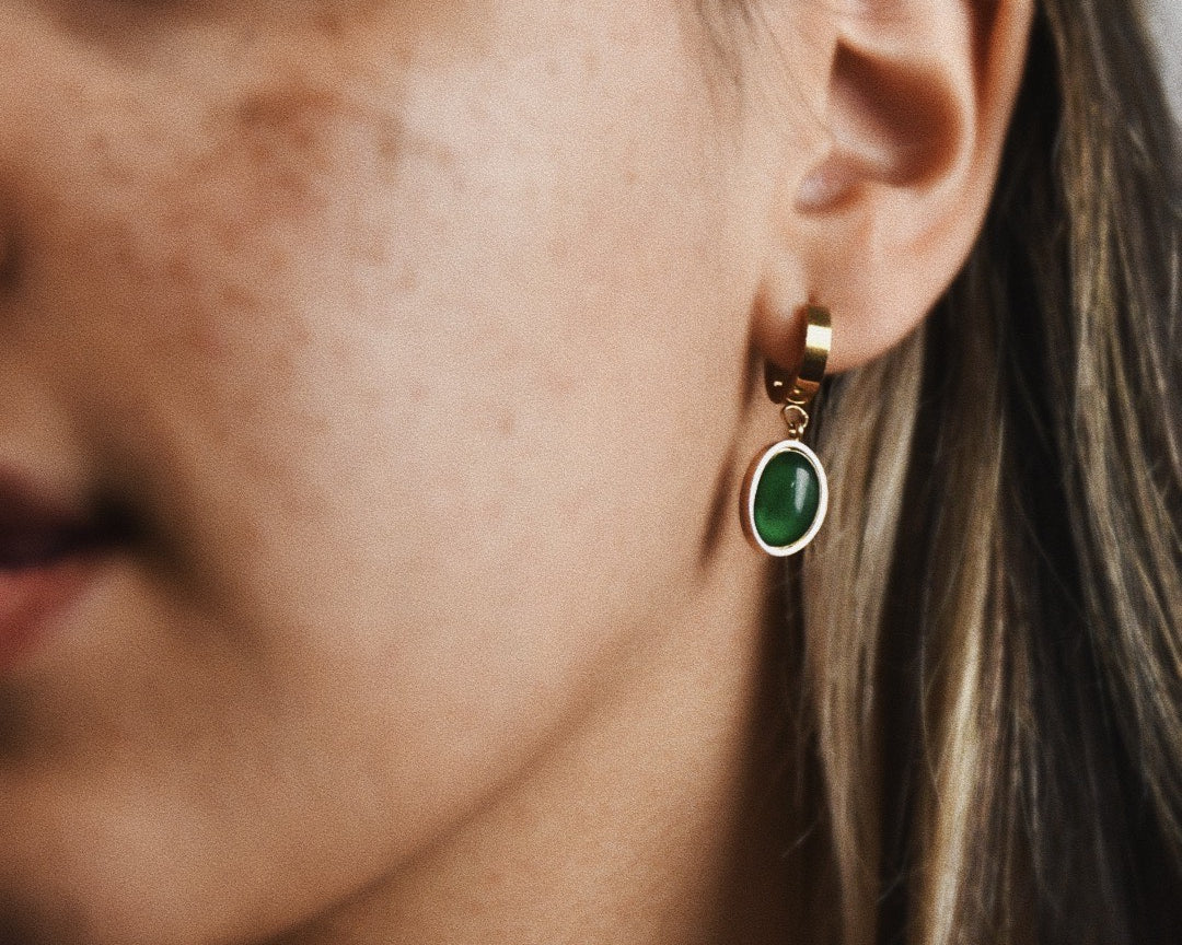 Woman wearing Emerald Green Small Hoop Earrings