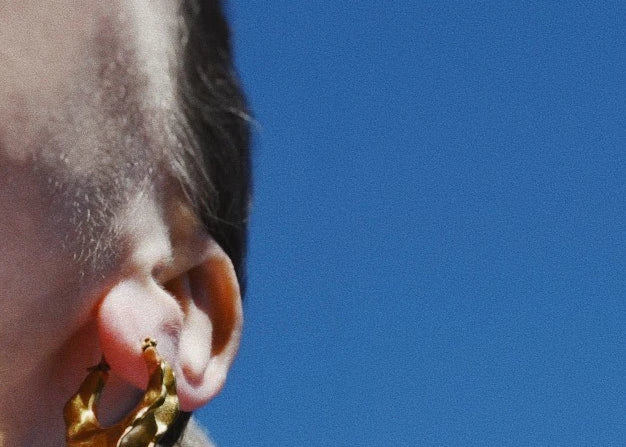 Woman wearing Antonia medium Irregular Gold Hoop Earrings