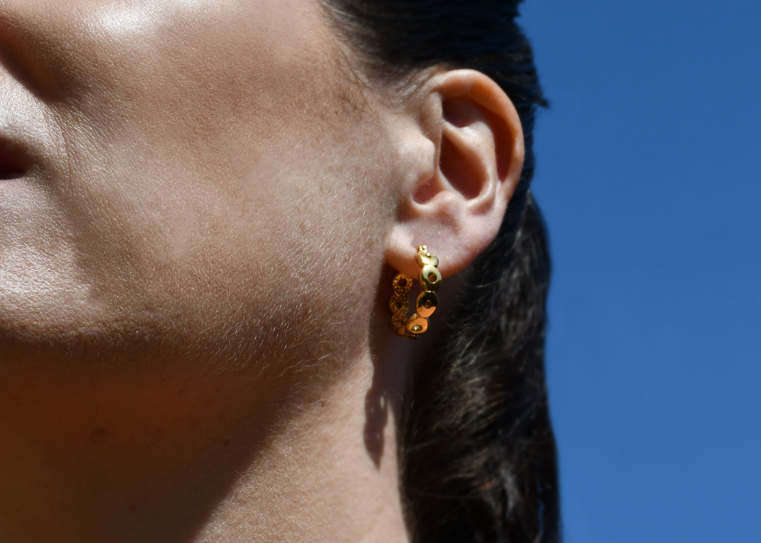 Woman wearing Circular Gold Hoop Earrings