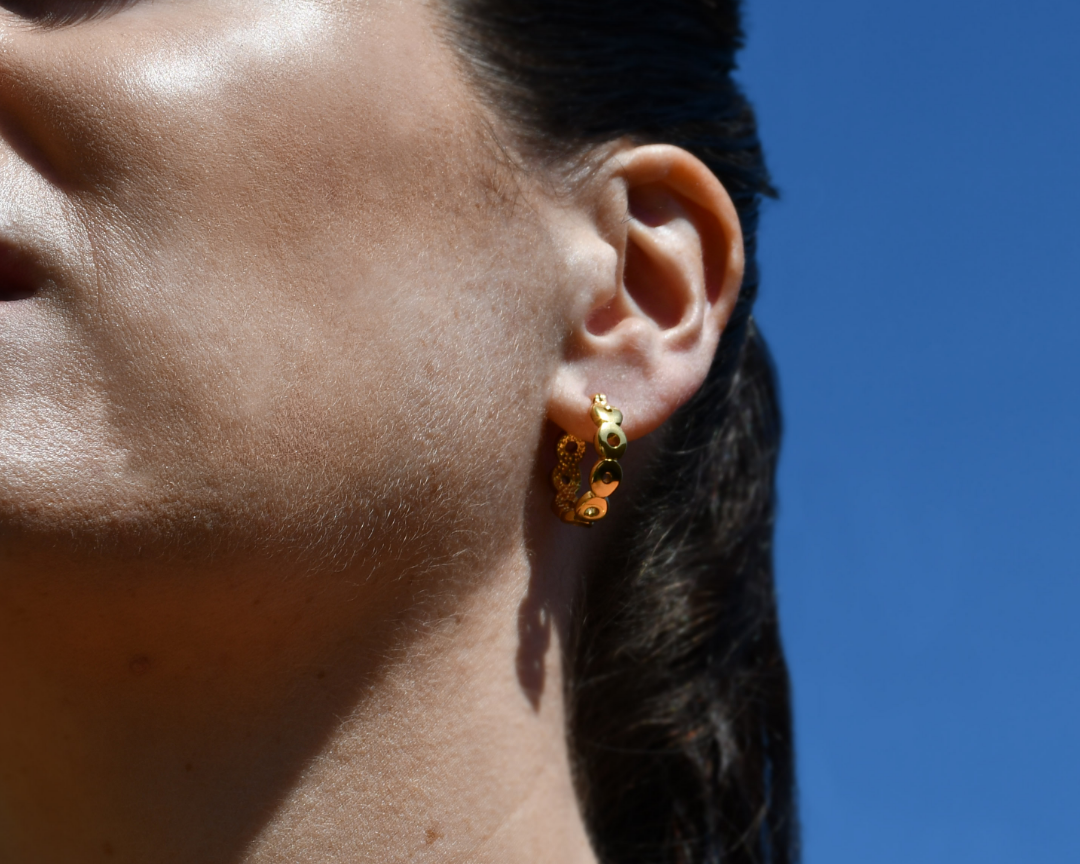 Woman wearing Circular Gold Hoop Earrings