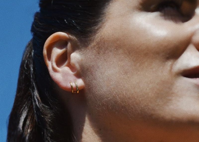 Woman wearing the Jay Gold Stud Earrings